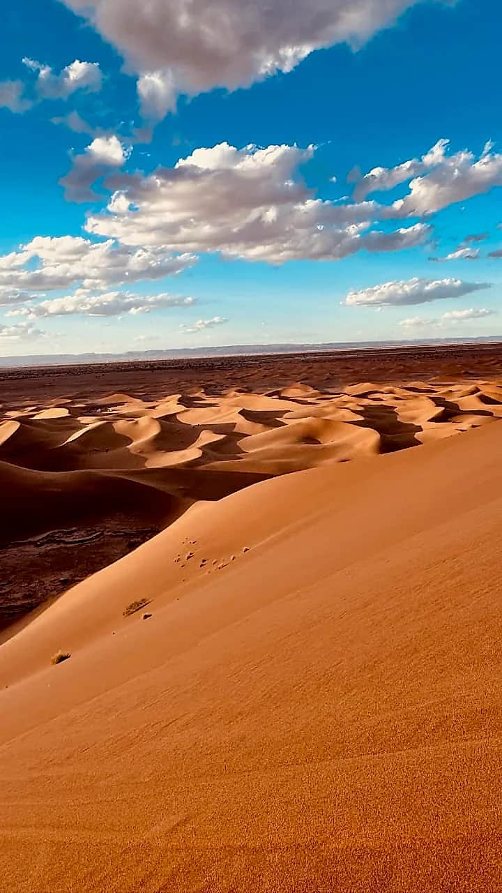 Afternoon clouds over the desert expanse