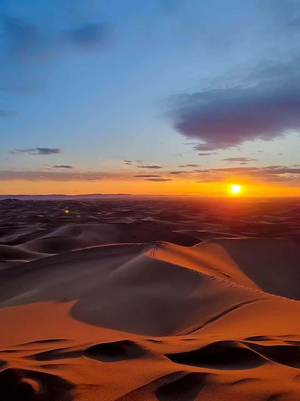 Golden hour illuminating the sands of M'Hamid